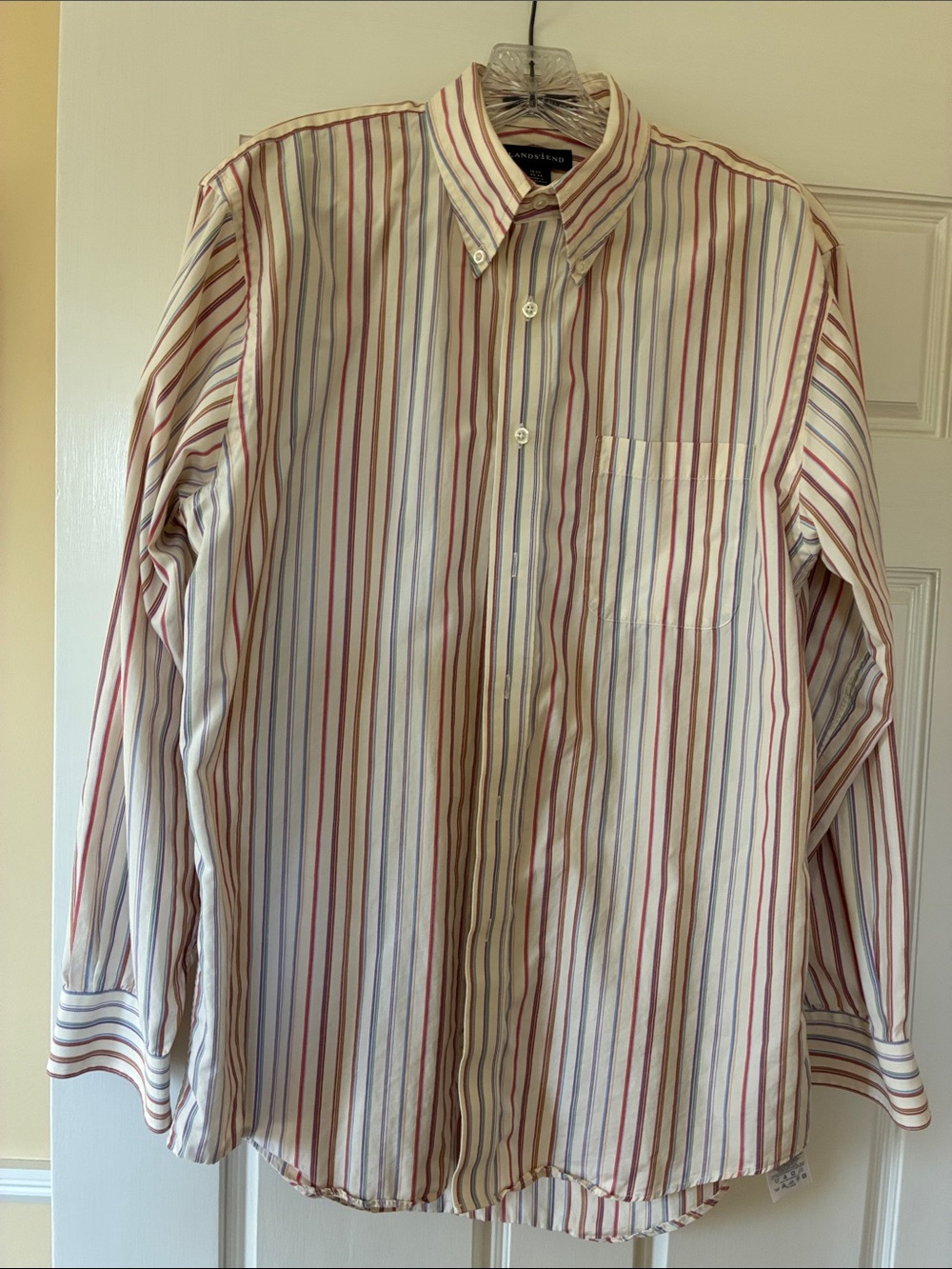 Classic button down collar shirt. Ecru background with earth tone stripes.